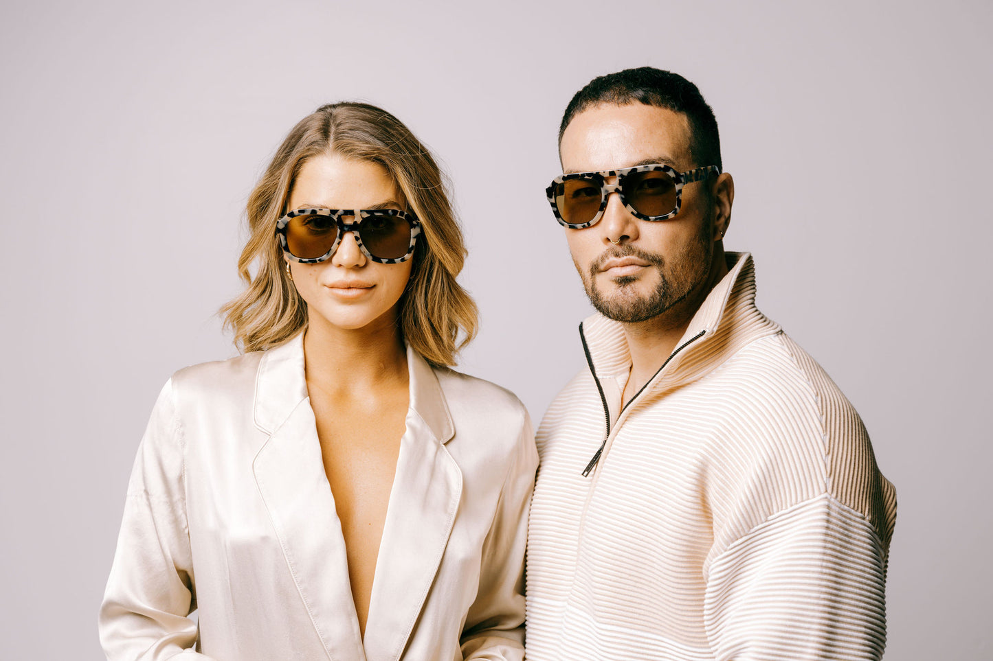 woman and man in cream clothing wear light tortoiseshell large aviator sustainable and biodegradable malone quinoa sunglasses with tan lens