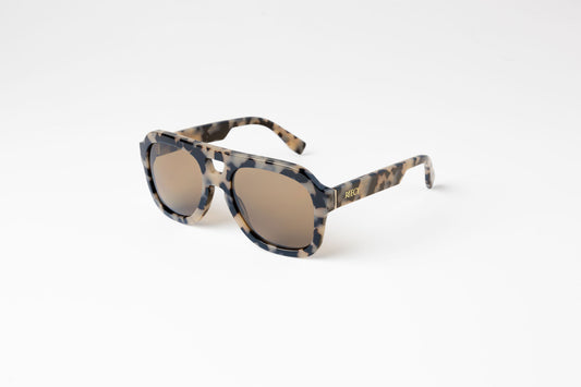 angle view of light tortoiseshell large aviator sustainable and biodegradable malone quinoa sunglasses with tan lens